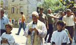 155. Fine anni '80: Danilo e altri in processione con don Vittorio Occhigrossi, "storico" parroco di Anticoli Corrado.