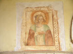 32. S. Maria in valle Porclaneta: La figurina di s. Lucia, quasi graffito colorato, posta a lato della porta... di mano maldestra, piuttosto rozza che ingenua,  da attribuire al periodo tra XVI e XVIII secolo. (Angeloni, "Santa Maria in valle Porclaneta", cit.)