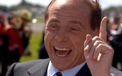 Meno intelligente di Obama? Chi, io? Ma l'intelligenza non si misura mica dall'abbronzatura!